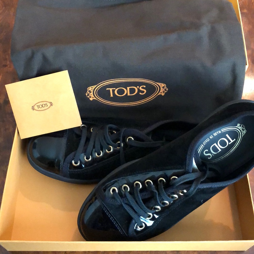 Tod’s black and gold sneakers